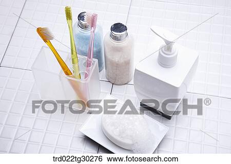 Colorful tooth brushes in cup, Bottles of bath salt, shampoo and soap View Large Photo Image Stock Photograph - Colorful tooth brushes in cup, Bottles of bath salt, shampoo and soap . Fotosearch