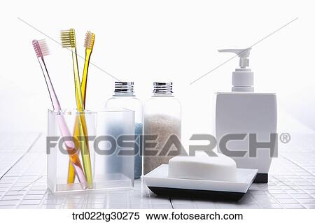 Colorful tooth brushes in cup, Bottles of bath salt, shampoo and soap View Large Photo Image Stock Photography - Colorful tooth brushes in cup, Bottles of bath salt, shampoo and soap . Fotosearch