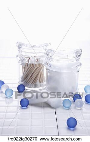 cotton swap and cotton in the plastic containers with blue balls around View Large Photo Image Stock Image - cotton swap and cotton in the plastic containers with blue balls around. Fotosearch