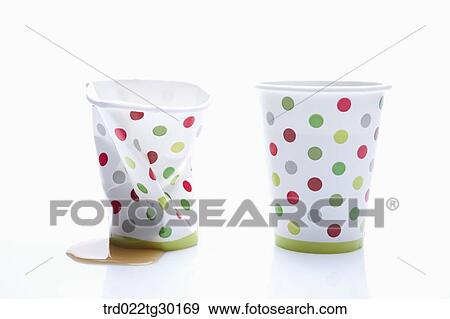 Stock Photo - Crumpled dot patterned paper cup and normal dot patterned paper cup . Fotosearch