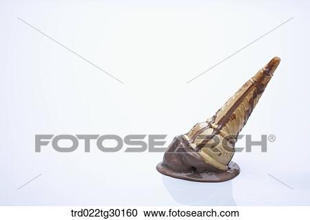 Stock Image - Crushed chocolate ice cream cone. Fotosearch