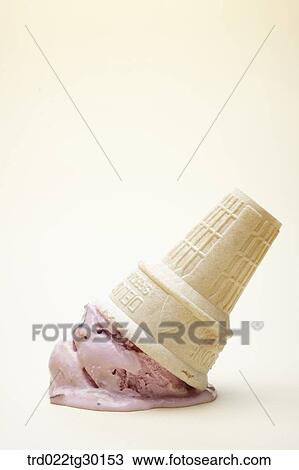 Stock Image - Crushed strawberry ice cream cone. Fotosearch
