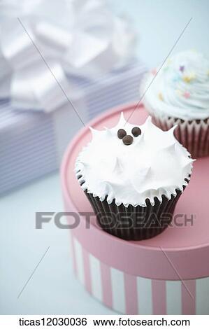 Cupcake and gift box View Large Photo Image Stock Photograph - Cupcake and gift box. Fotosearch