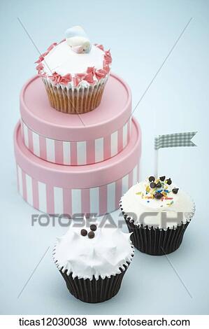 Cupcake and pink gift box View Large Photo Image Stock Photo - Cupcake and pink gift box. Fotosearch