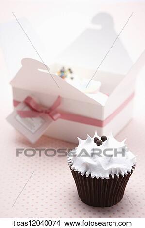 Cupcake in pink ribbon gift box View Large Photo Image Picture - Cupcake in pink ribbon gift box. Fotosearch