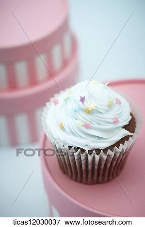 Cupcake on the pink gift box View Large Photo Image Stock Photo - Cupcake on the pink gift box. Fotosearch