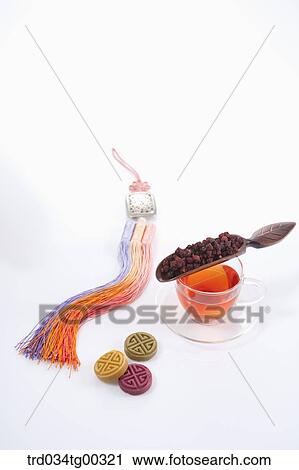 Dried fruit and a cup of tea with Korean dessert and traditional accessory around View Large Photo Image Stock Image - Dried fruit and a cup of tea with Korean dessert and traditional accessory around. Fotosearch