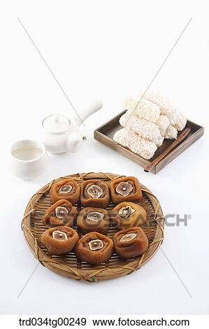 Dried persimmons, Korean dessert, and tea setting View Large Photo Image Stock Photo - Dried persimmons, Korean dessert, and tea setting . Fotosearch