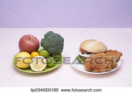 Fast food and fresh vegetable View Large Photo Image Stock Photo - Fast food and fresh vegetable. Fotosearch