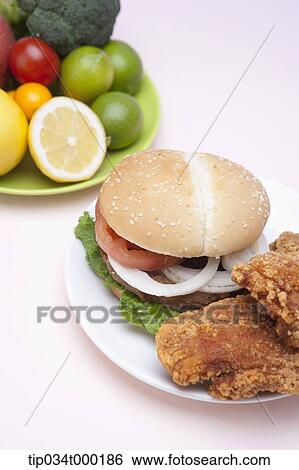 Fast food and fresh vegetable View Large Photo Image Stock Photograph - Fast food and fresh vegetable. Fotosearch