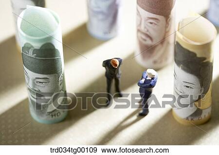 figures and rolled paper bills View Large Photo Image Stock Photo - figures and rolled paper bills. Fotosearch