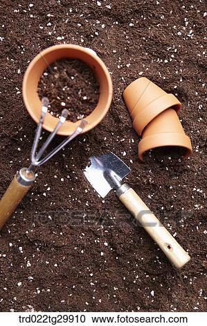 flowerpots and shovel and hook is on the dirt View Large Photo Image Stock Image - flowerpots and shovel and hook is on the dirt. Fotosearch