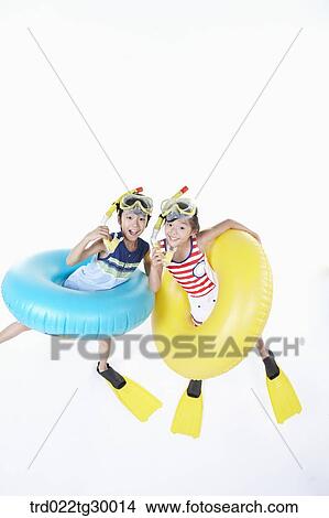 girl and boy are wearing snorkels and tube and flippers View Large Photo Image Picture - girl and boy are wearing snorkels and tube and flippers. Fotosearch