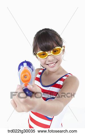 girl is holding water guns on ahead View Large Photo Image Stock Photography - girl is holding water guns on ahead. Fotosearch