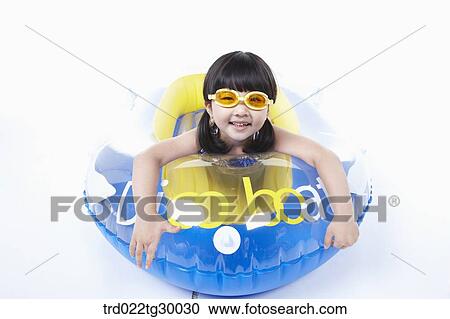Stock Image - girl is lying face down on the boat. Fotosearch