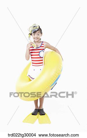 Picture - girl is wearing snorkels and tube and flippers. Fotosearch