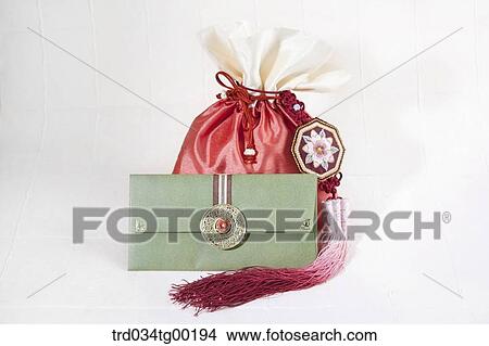 Green envelope and red lucky bag View Large Photo Image Picture - Green envelope and red lucky bag. Fotosearch