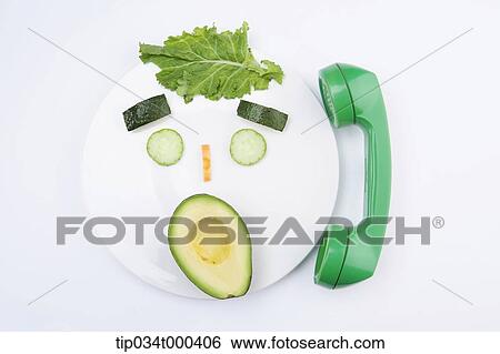 Green face of vegetable answering the phone View Large Photo Image Stock Photograph - Green face of vegetable answering the phone. Fotosearch