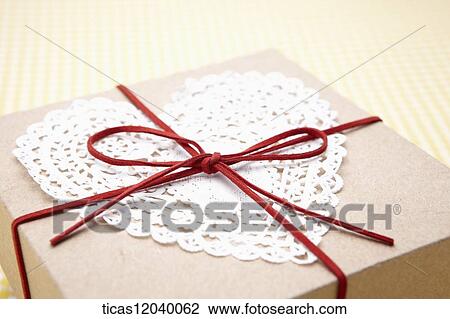 Heart lace gift box with red ribbon View Large Photo Image Stock Image - Heart lace gift box with red ribbon . Fotosearch