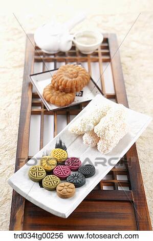 Stock Photograph - Korean dessert and tea setting on the Korean traditional door. Fotosearch