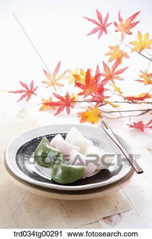 Korean rice cake on the dish with colored leaves behind View Large Photo Image Stock Image - Korean rice cake on the dish with colored leaves behind. Fotosearch