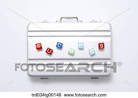 Stock Photo - letters of success on the brief case. Fotosearch