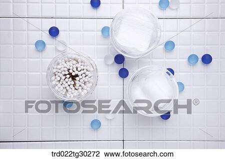 Stock Image - Make up cotton, cotton swap, and cotton in the plastic containers from the above. Fotosearch