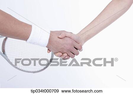 Male and female tennis players shaking hands View Large Photo Image Stock Photo - Male and female tennis players shaking hands. Fotosearch