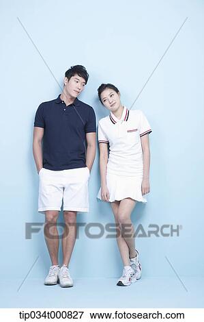 Stock Photo - Male and female tennis players. Fotosearch