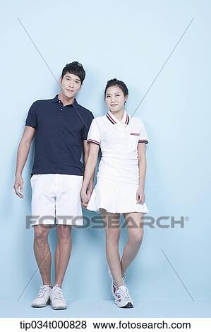 Stock Photo - Male and female tennis players. Fotosearch