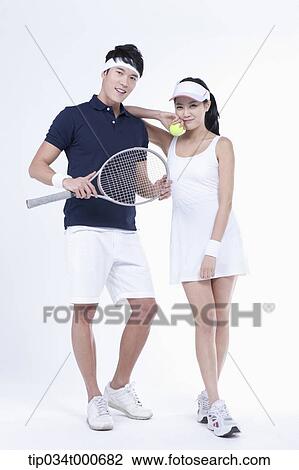 Male and female tennis players with a ball and racket View Large Photo Image Stock Image - Male and female tennis players with a ball and racket. Fotosearch