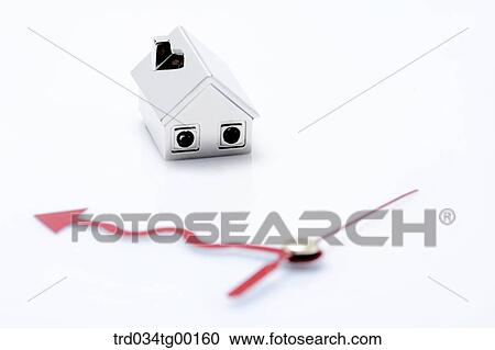 Stock Image - miniature house with hands of clock. Fotosearch