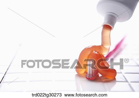 Orange tooth paste squeezed onto pink tooth brush View Large Photo Image Stock Image - Orange tooth paste squeezed onto pink tooth brush . Fotosearch