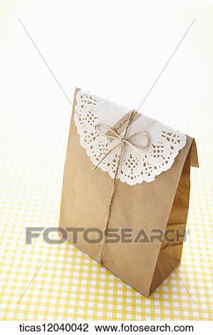 Paper gift package with white lace paper View Large Photo Image Stock Image - Paper gift package with white lace paper. Fotosearch