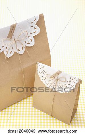 Paper gift package with white lace paper View Large Photo Image Stock Image - Paper gift package with white lace paper. Fotosearch