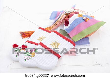 Patched colorful lucky bags, traditional socks, and clothes accessory View Large Photo Image Stock Photo - Patched colorful lucky bags, traditional socks, and clothes accessory. Fotosearch