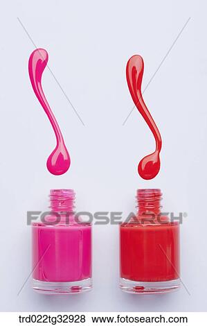 Stock Photo - Pink and orange nail polish. Fotosearch