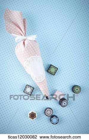 Pink icing bag and lace patterned chocolate View Large Photo Image Stock Image - Pink icing bag and lace patterned chocolate. Fotosearch