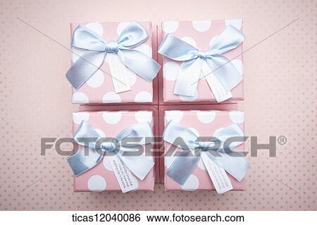 Pink polka dot gift box with blue ribbon View Large Photo Image Stock Photograph - Pink polka dot gift box with blue ribbon . Fotosearch