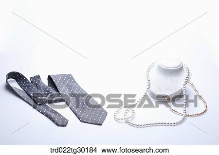 Polka dot tie and pearl necklace View Large Photo Image Picture - Polka dot tie and pearl necklace. Fotosearch