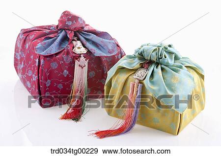 Red and green traditional wrapped package in cloth View Large Photo Image Stock Photo - Red and green traditional wrapped package in cloth . Fotosearch