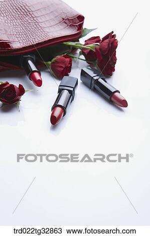 Red lipstick and rose in the red pouch View Large Photo Image Stock Image - Red lipstick and rose in the red pouch. Fotosearch