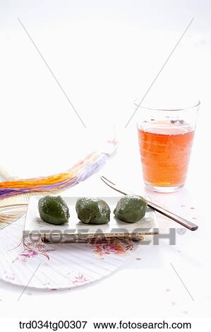 Rice cake, a glass of drink, and traditional clothes accessory View Large Photo Image Stock Photo - Rice cake, a glass of drink, and traditional clothes accessory . Fotosearch