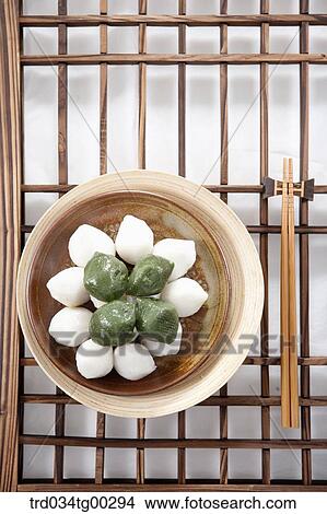 Rice cake and chopsticks on Korean traditonal door View Large Photo Image Picture - Rice cake and chopsticks on Korean traditonal door. Fotosearch