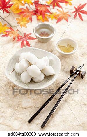 Rice cake, cups of tea, and chopsticks View Large Photo Image Stock Image - Rice cake, cups of tea, and chopsticks. Fotosearch