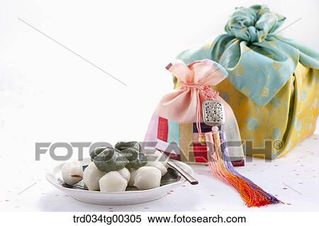 Rice cake, patched lucky bag, and traditional wrapped package View Large Photo Image Stock Photography - Rice cake, patched lucky bag, and traditional wrapped package. Fotosearch