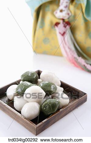 Rice cake with traditional wrapped package behind View Large Photo Image Stock Image - Rice cake with traditional wrapped package behind. Fotosearch