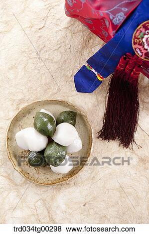 Rice cake with traditional wrapped package around View Large Photo Image Stock Photo - Rice cake with traditional wrapped package around. Fotosearch