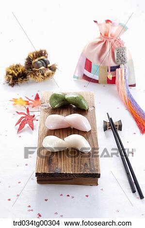 Rice cake, wooden chopsticks, chestnuts, and patched lucky bag View Large Photo Image Picture - Rice cake, wooden chopsticks, chestnuts, and patched lucky bag. Fotosearch