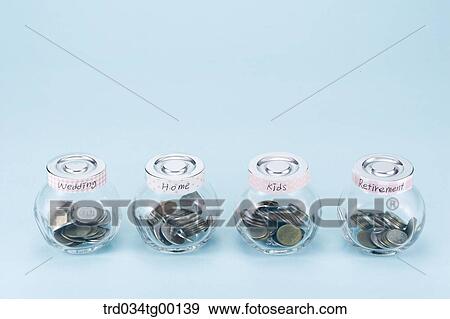 saving coins for living items View Large Photo Image Stock Photo - saving coins for living items. Fotosearch